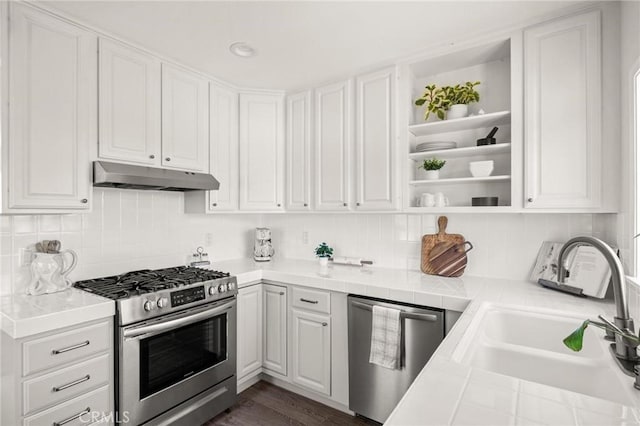 1108 Stanford Ave, Redondo Beach, CA 90278 - kitchen featuring stainless steel appliances, under cabinet range hood, a sink, open shelves, and white cabinetry
