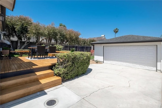1108 Stanford Ave, Redondo Beach, CA 90278 - view of side of property with outdoor dining area, a deck, stucco siding, and a detached garage