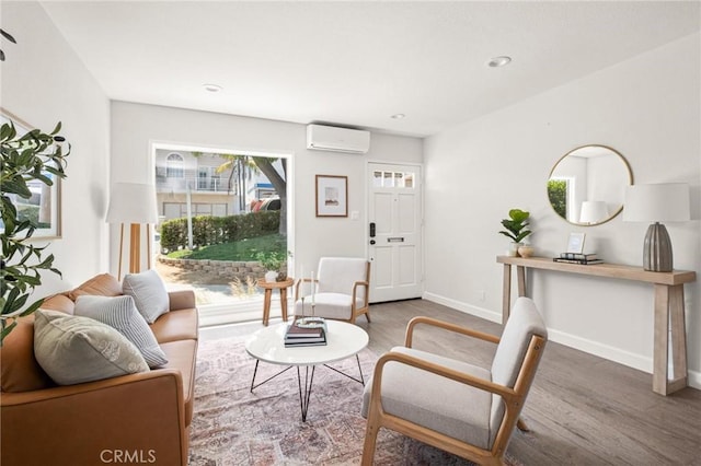 1108 Stanford Ave, Redondo Beach, CA 90278 - living area with a wall mounted AC, wood finished floors, baseboards, and recessed lighting