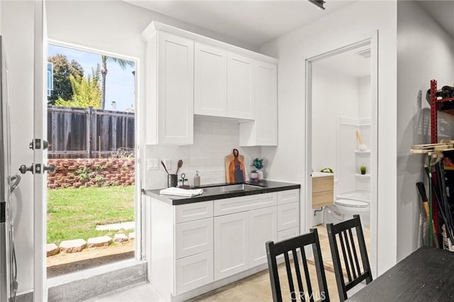1108 Stanford Ave, Redondo Beach, CA 90278 - kitchen with white cabinets and decorative backsplash