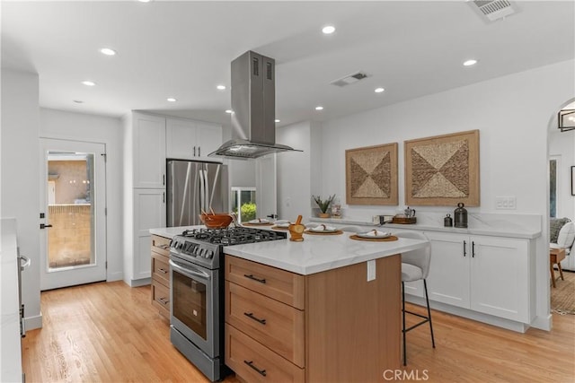 1848 Lave Ave, Long Beach, CA 90815 - kitchen featuring appliances with stainless steel finishes, island range hood, light wood finished floors, a center island, and recessed lighting