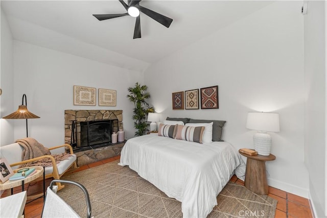 1848 Lave Ave, Long Beach, CA 90815 - bedroom with a stone fireplace, ceiling fan, vaulted ceiling, and baseboards