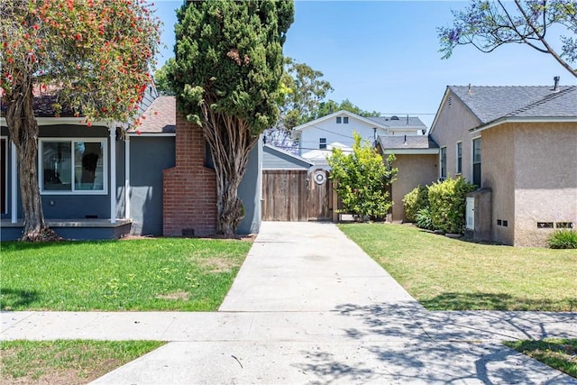 1848 Lave Ave, Long Beach, CA 90815 - view of front of property with stucco siding, concrete driveway, a gate, and a shingled roof