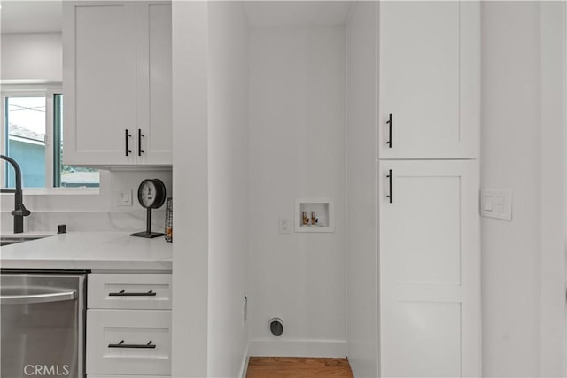 1848 Lave Ave, Long Beach, CA 90815 - laundry room with hookup for a washing machine, wood finished floors, and baseboards