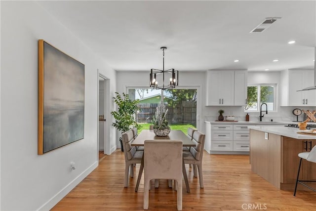 1848 Lave Ave, Long Beach, CA 90815 - dining space featuring a chandelier, light wood finished floors, baseboards, and recessed lighting