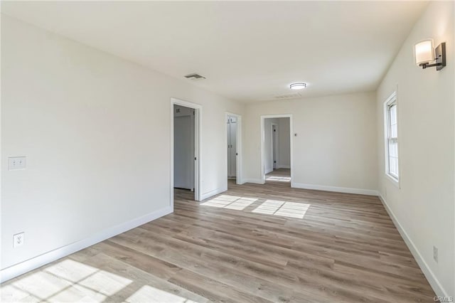 390 E 4th St, San Bernardino, CA 92410 - unfurnished room with baseboards and light wood-style floors