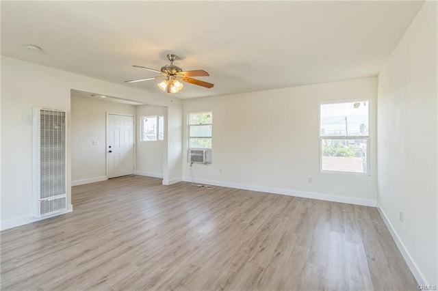 390 E 4th St, San Bernardino, CA 92410 - unfurnished room with a heating unit, light wood finished floors, ceiling fan, baseboards, and a smoke detector