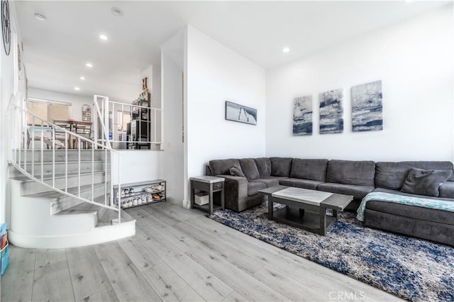 9950 Topanga Canyon Blvd Unit 5, Chatsworth, CA 91311 - living room featuring wood finished floors, recessed lighting, and stairway