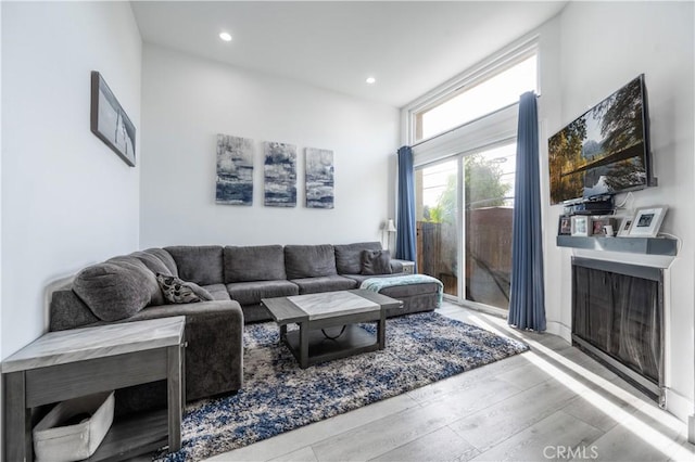 9950 Topanga Canyon Blvd Unit 5, Chatsworth, CA 91311 - living room with wood finished floors, recessed lighting, and a fireplace