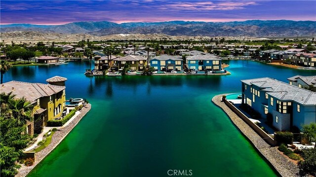 43228 Bacino Ct, Indio, CA 92203 - aerial view at dusk of a residential view and a water and mountain view