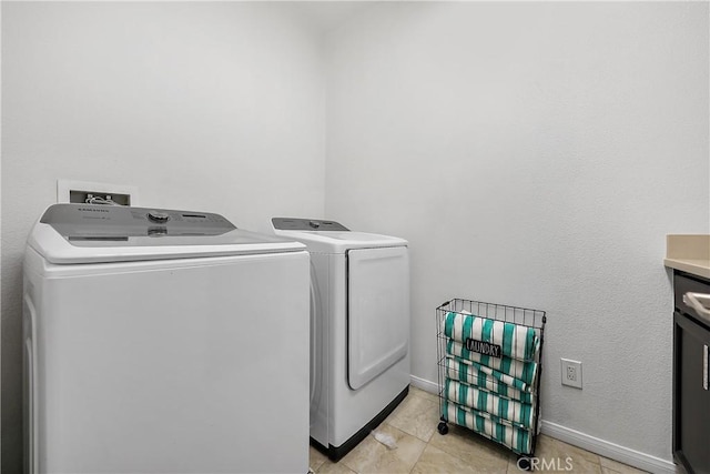 43228 Bacino Ct, Indio, CA 92203 - washroom with independent washer and dryer, baseboards, and light tile patterned floors