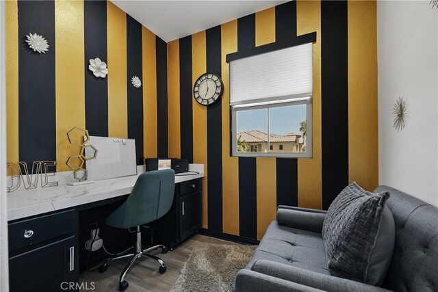 43228 Bacino Ct, Indio, CA 92203 - office featuring wood finished floors, wallpapered walls, baseboards, and built in study area