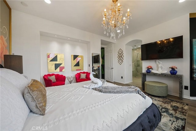 43228 Bacino Ct, Indio, CA 92203 - bedroom featuring wood finished floors, arched walkways, baseboards, a chandelier, and recessed lighting