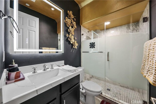 43228 Bacino Ct, Indio, CA 92203 - bathroom featuring a stall shower, vanity, and toilet