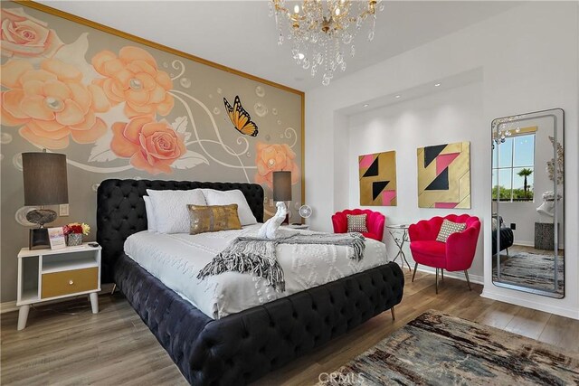 43228 Bacino Ct, Indio, CA 92203 - bedroom featuring a chandelier, wood finished floors, and baseboards