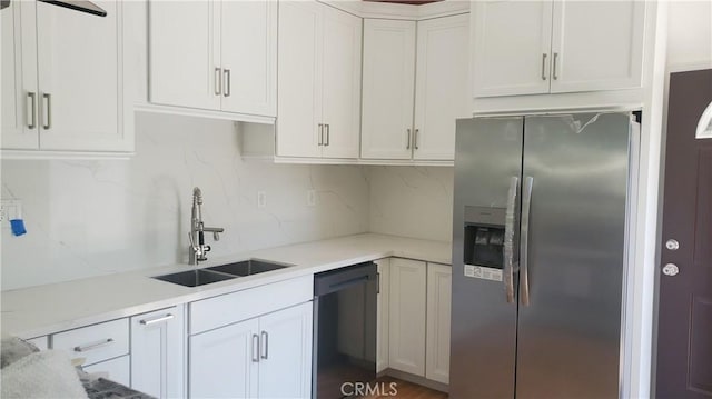 1330 W 48th St, Los Angeles, CA 90037 - kitchen with stainless steel fridge with ice dispenser, black dishwasher, a sink, decorative backsplash, and white cabinets
