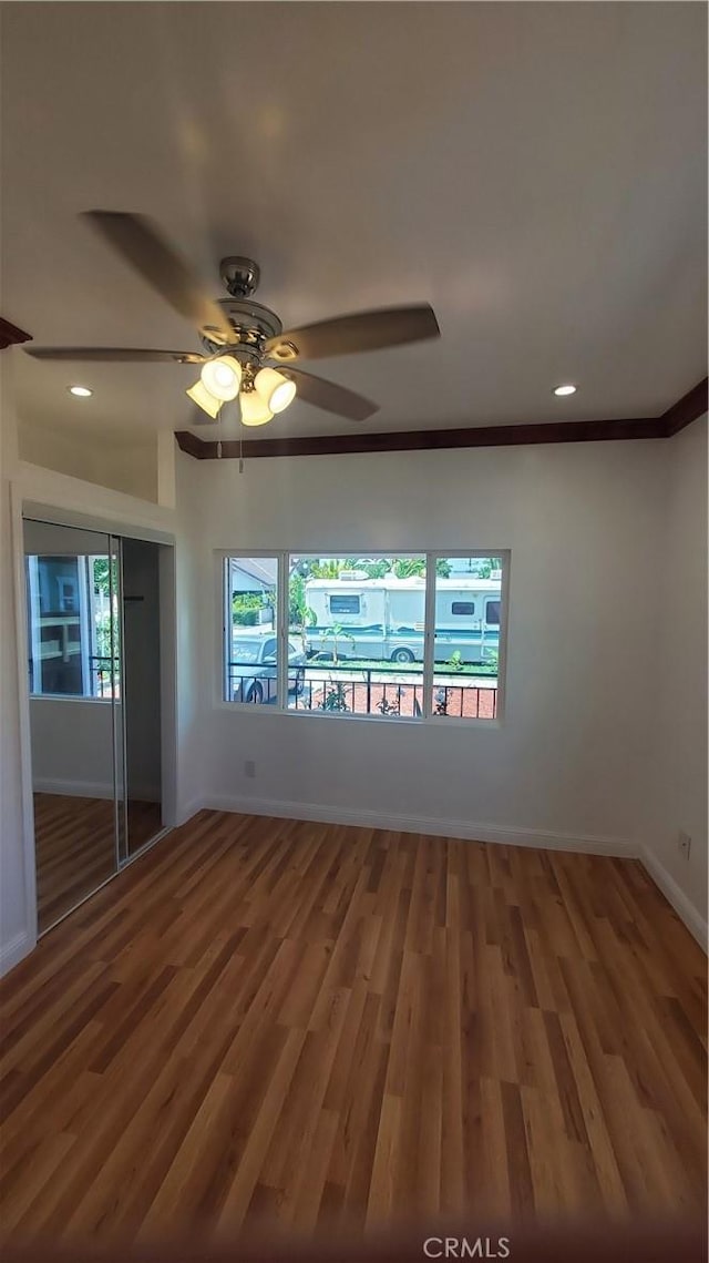 1330 W 48th St, Los Angeles, CA 90037 - empty room featuring baseboards, wood finished floors, a ceiling fan, recessed lighting, and ornamental molding