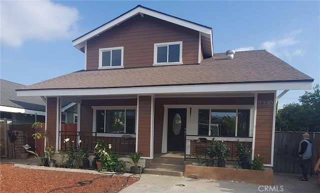 1330 W 48th St, Los Angeles, CA 90037 - view of front facade featuring covered porch and roof with shingles