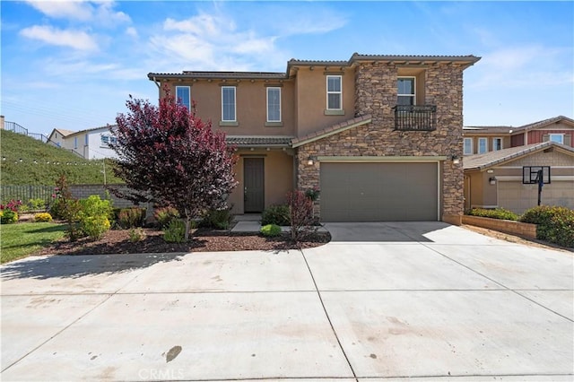 29015 Ridgecrest Ct, Valencia, CA 91354 - view of front of house featuring driveway, stone siding, a garage, stucco siding, and a tile roof