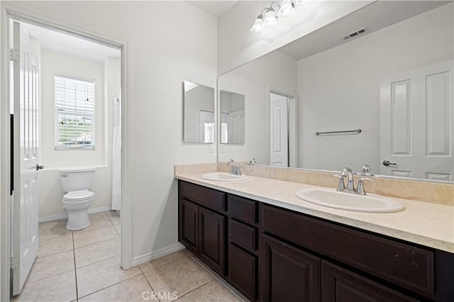 29015 Ridgecrest Ct, Valencia, CA 91354 - bathroom with double vanity, toilet, tile patterned floors, and baseboards