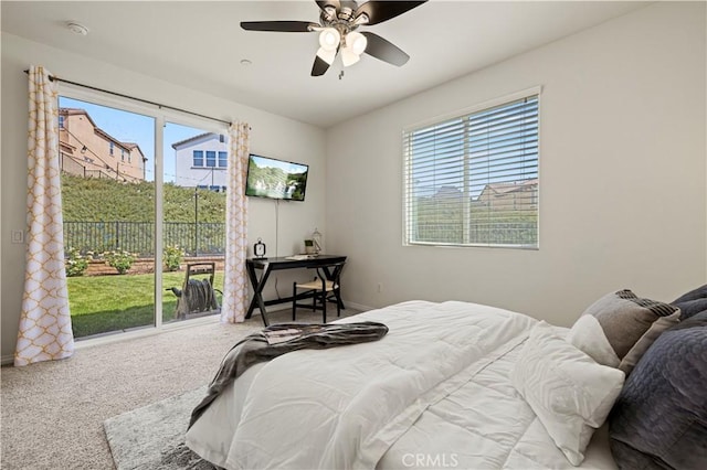 29015 Ridgecrest Ct, Valencia, CA 91354 - carpeted bedroom featuring access to exterior, multiple windows, a ceiling fan, and baseboards