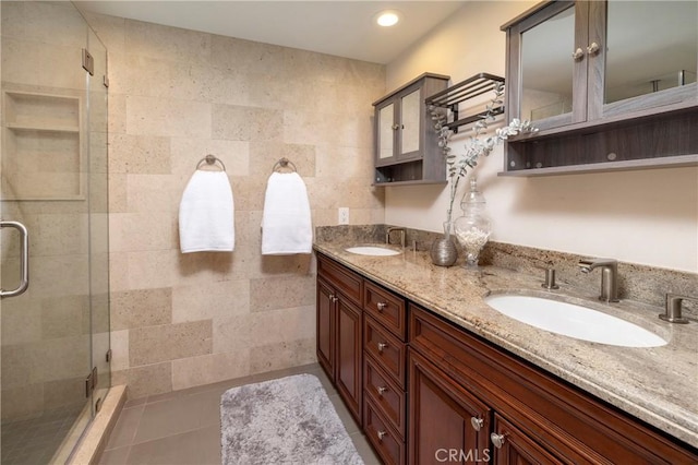 16561 Wanderer Ln, Huntington Beach, CA 92649 - full bath with a shower stall, double vanity, recessed lighting, and tile patterned floors