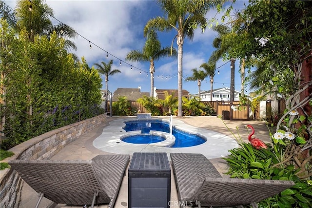 16561 Wanderer Ln, Huntington Beach, CA 92649 - view of swimming pool featuring a fenced backyard, a patio, and a pool with connected hot tub