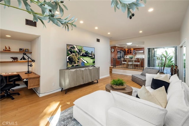 16561 Wanderer Ln, Huntington Beach, CA 92649 - living room with light wood-type flooring, an office area, recessed lighting, and baseboards