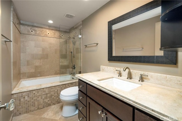 16561 Wanderer Ln, Huntington Beach, CA 92649 - bathroom featuring toilet, tiled shower / bath combo, vanity, tile patterned flooring, and recessed lighting