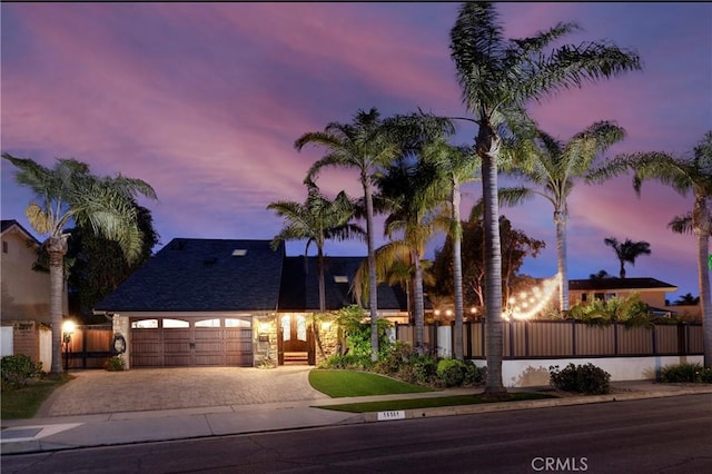 16561 Wanderer Ln, Huntington Beach, CA 92649 - view of front of property with decorative driveway and an attached garage