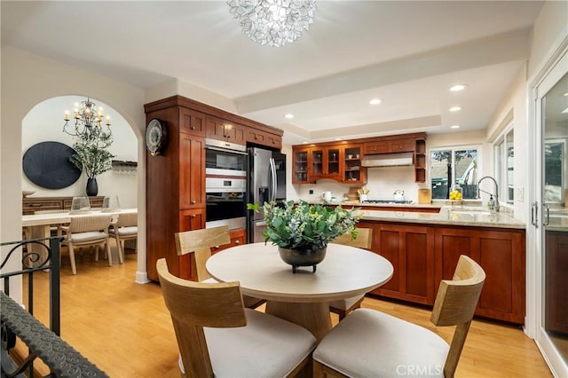 16561 Wanderer Ln, Huntington Beach, CA 92649 - dining space featuring a chandelier, light wood-style flooring, and recessed lighting