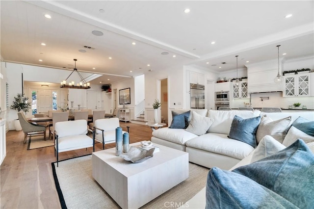 2001 Oak Ave, Manhattan Beach, CA 90266 - living room featuring recessed lighting, a chandelier, light wood-style flooring, stairs, and beamed ceiling