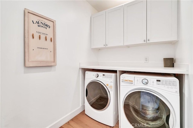 2001 Oak Ave, Manhattan Beach, CA 90266 - laundry area with cabinet space, independent washer and dryer, light wood finished floors, and baseboards