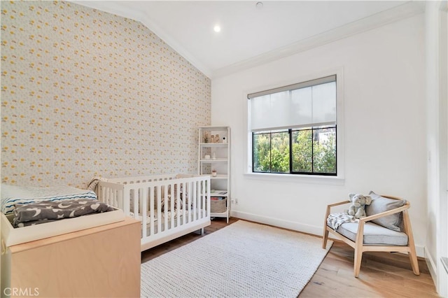 2001 Oak Ave, Manhattan Beach, CA 90266 - bedroom with vaulted ceiling, ornamental molding, wallpapered walls, baseboards, and wood finished floors