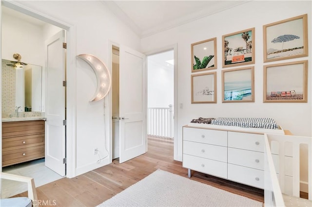 2001 Oak Ave, Manhattan Beach, CA 90266 - bedroom with light wood-style floors, ornamental molding, a sink, and connected bathroom