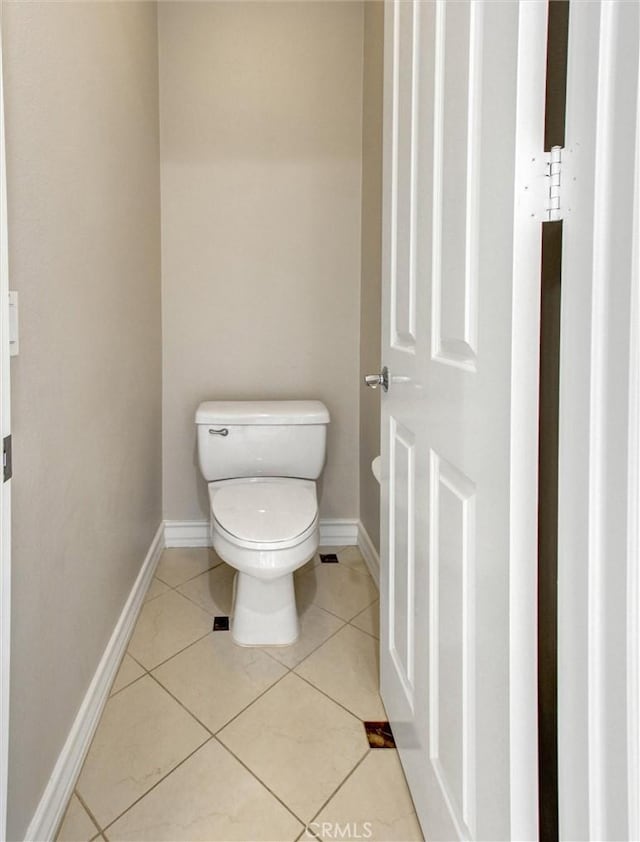 2237 Sageleaf Cir, Corona, CA 92882 - bathroom featuring toilet, baseboards, and tile patterned floors