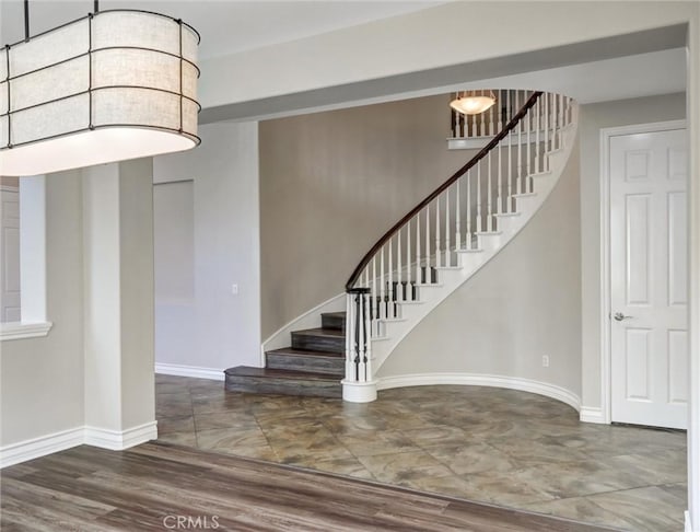2237 Sageleaf Cir, Corona, CA 92882 - stairs featuring baseboards and wood finished floors