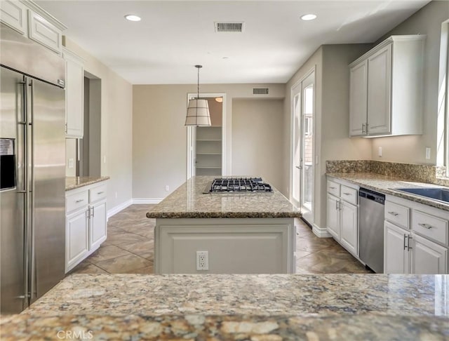2237 Sageleaf Cir, Corona, CA 92882 - kitchen featuring stainless steel appliances, white cabinetry, baseboards, light stone counters, and recessed lighting