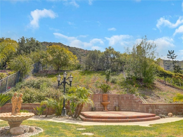 2237 Sageleaf Cir, Corona, CA 92882 - fenced backyard featuring a mountain view and a patio