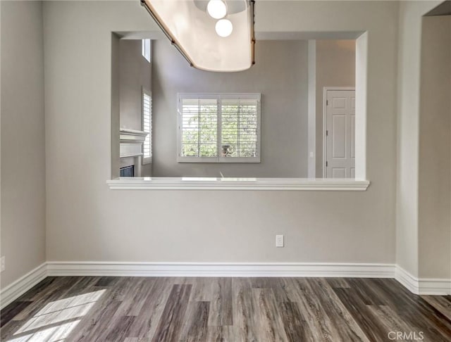 2237 Sageleaf Cir, Corona, CA 92882 - empty room with wood finished floors, baseboards, and a glass covered fireplace
