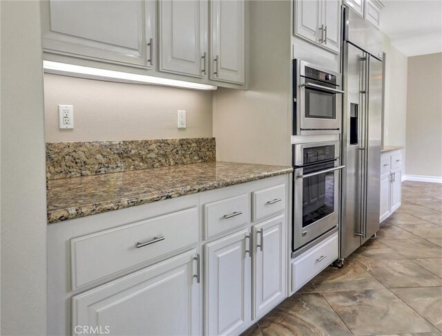 2237 Sageleaf Cir, Corona, CA 92882 - kitchen with stainless steel appliances, white cabinets, and light stone countertops
