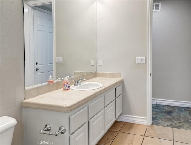 2237 Sageleaf Cir, Corona, CA 92882 - bathroom featuring vanity, toilet, and tile patterned flooring