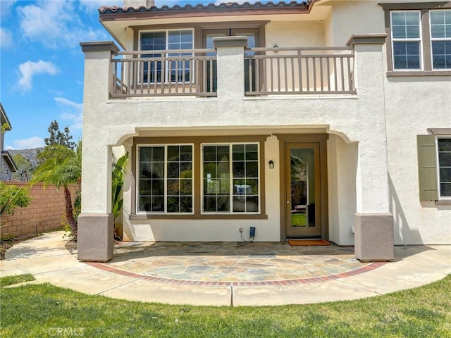 2237 Sageleaf Cir, Corona, CA 92882 - back of house featuring a balcony, stucco siding, and a patio area