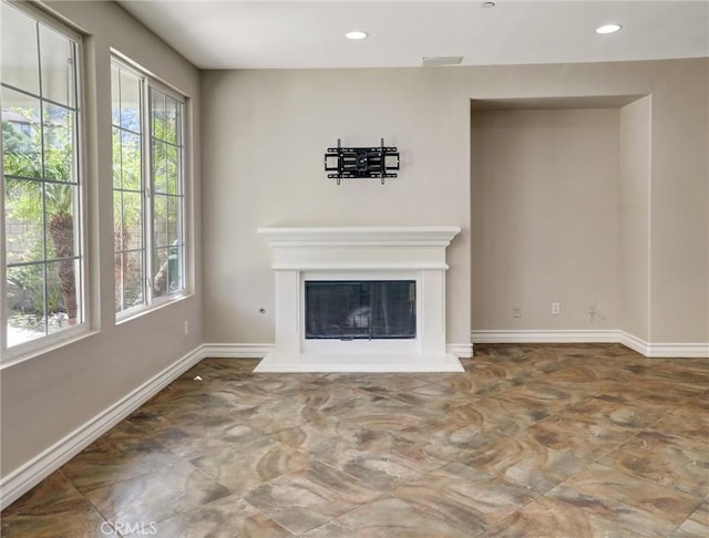 2237 Sageleaf Cir, Corona, CA 92882 - unfurnished living room with plenty of natural light, baseboards, a glass covered fireplace, and recessed lighting