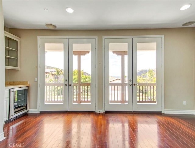 2237 Sageleaf Cir, Corona, CA 92882 - doorway to outside with french doors, beverage cooler, plenty of natural light, and recessed lighting