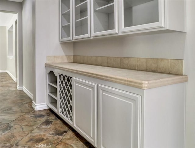 2237 Sageleaf Cir, Corona, CA 92882 - bar area with baseboards and dark stone finish floors