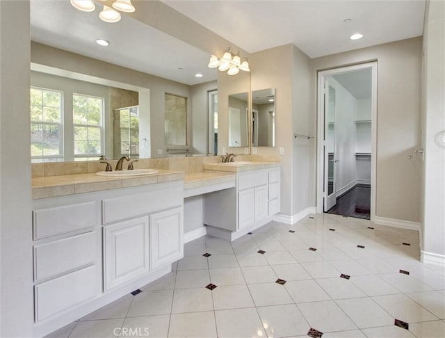 2237 Sageleaf Cir, Corona, CA 92882 - bathroom with double vanity, baseboards, recessed lighting, tile patterned floors, and a walk in closet
