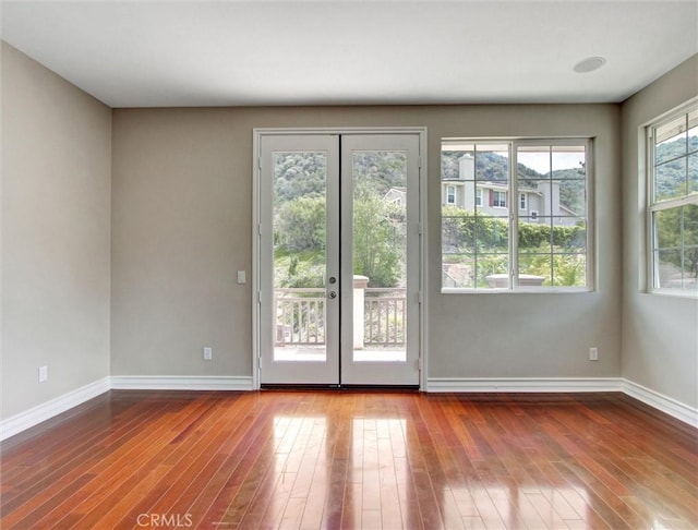 2237 Sageleaf Cir, Corona, CA 92882 - empty room with baseboards and hardwood / wood-style flooring