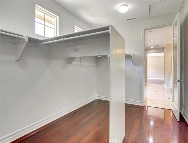 2237 Sageleaf Cir, Corona, CA 92882 - walk in closet with dark wood finished floors and attic access