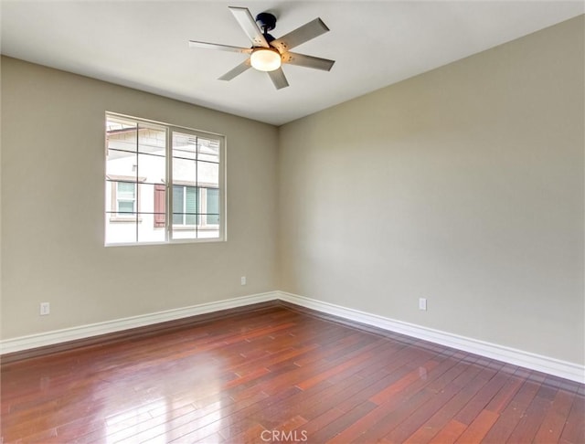 2237 Sageleaf Cir, Corona, CA 92882 - spare room featuring dark wood-style flooring, baseboards, and a ceiling fan